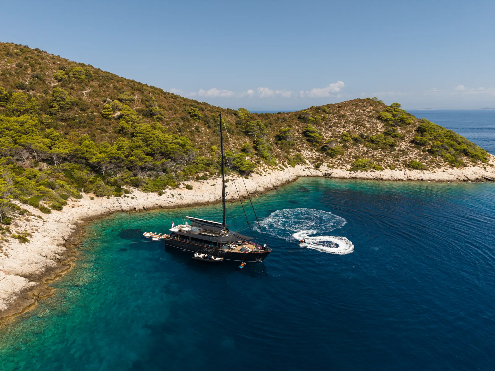 S/Y Rara Avis anchored in a quiet cove on Vis