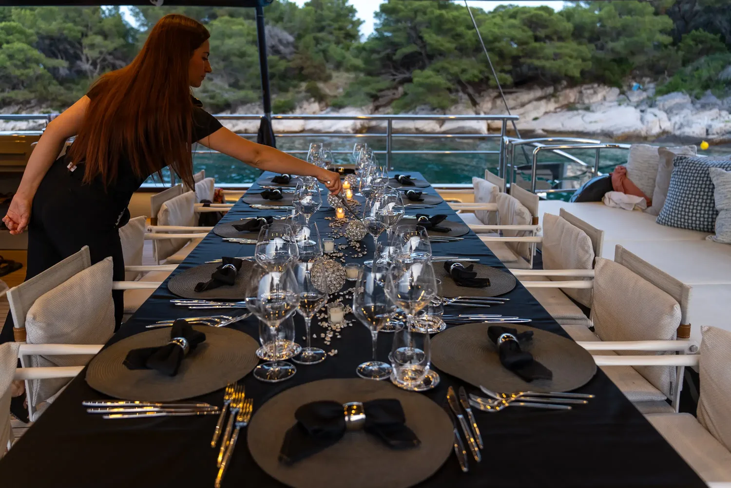 Hostess preparing dinner table